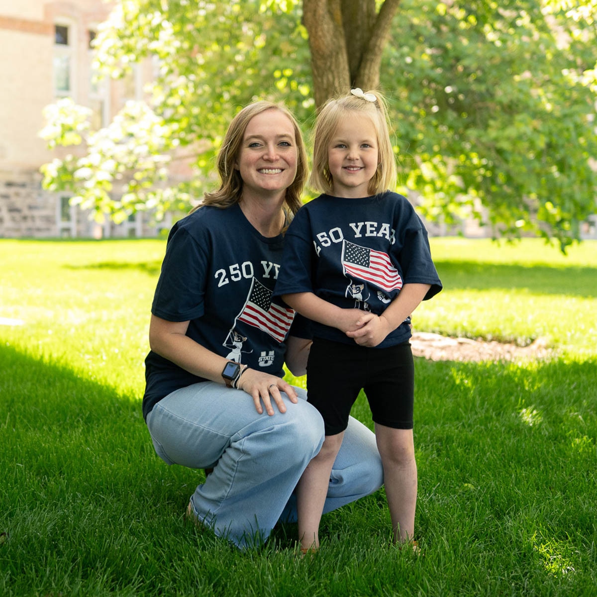 Mom and daughter wearing matching patriotic t-shirts